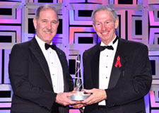 Dr. Michael Griffin (right) presents the National Space Trophy to Dr. John Grunsfeld