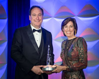 JSC Director Ellen Ochoa presents the National Space Trophy to former NASA Acting Administrator Robert Lightfoot